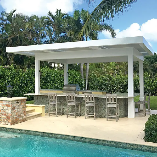 Pergola providing shade over a poolside outdoor kitchen and bar area.